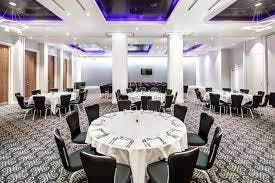 Azzuro 1 Suite at Radisson Blu Cardiff, elegant dining setup for corporate events.