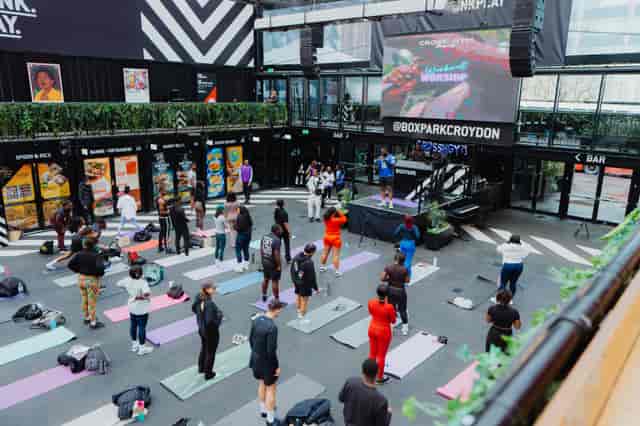 Wellness event venue takeover at Boxpark Croydon with integrated audiovisual setup.