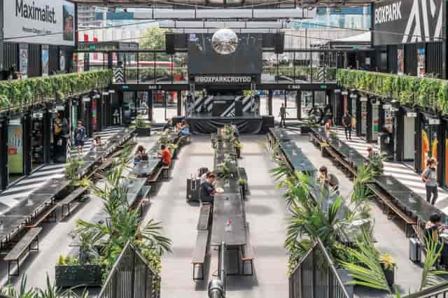 Boxpark Croydon venue takeover: industrial-chic event space with stage for corporate networking.