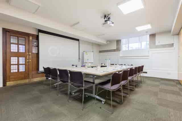 Ada Salter Suite meeting room with large table, ideal for workshops and presentations.