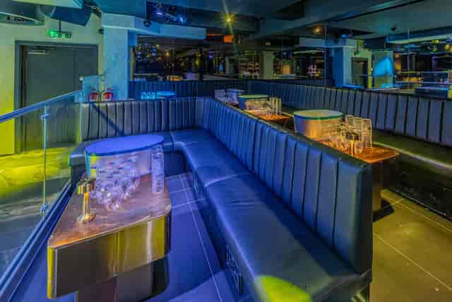 Sleek lounge area with plush seating for networking events and private parties.