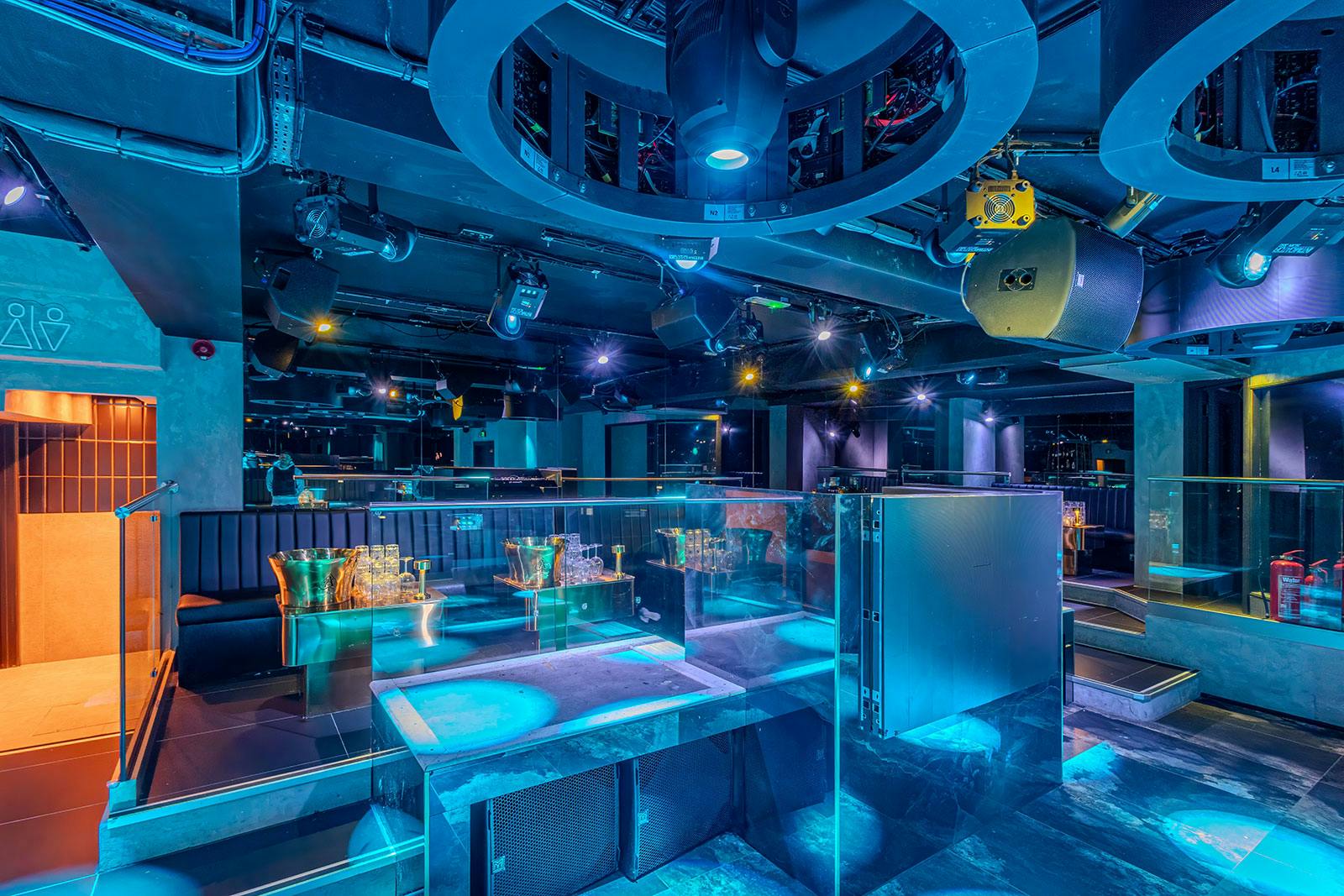 Modern event space with ambient lighting, ideal for corporate gatherings and celebrations.