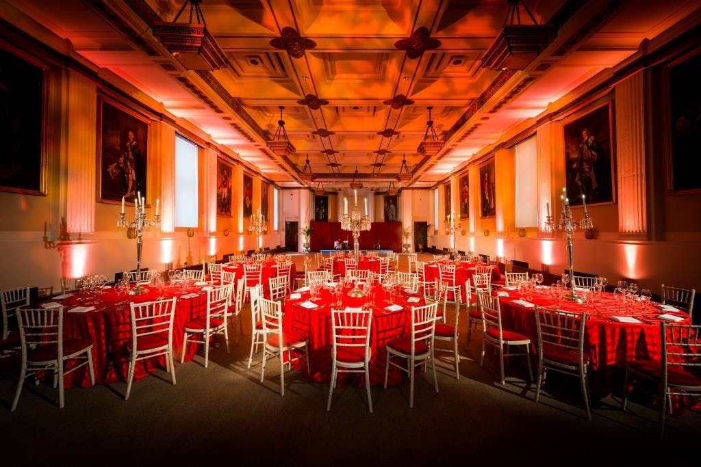 Elegant banquet hall with red linens, ideal for gala dinners and corporate events.