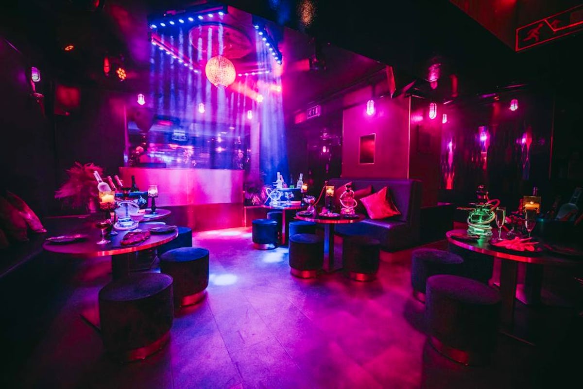 Vibrant lounge in Club Royale London, ideal for upscale events and networking. - Banner