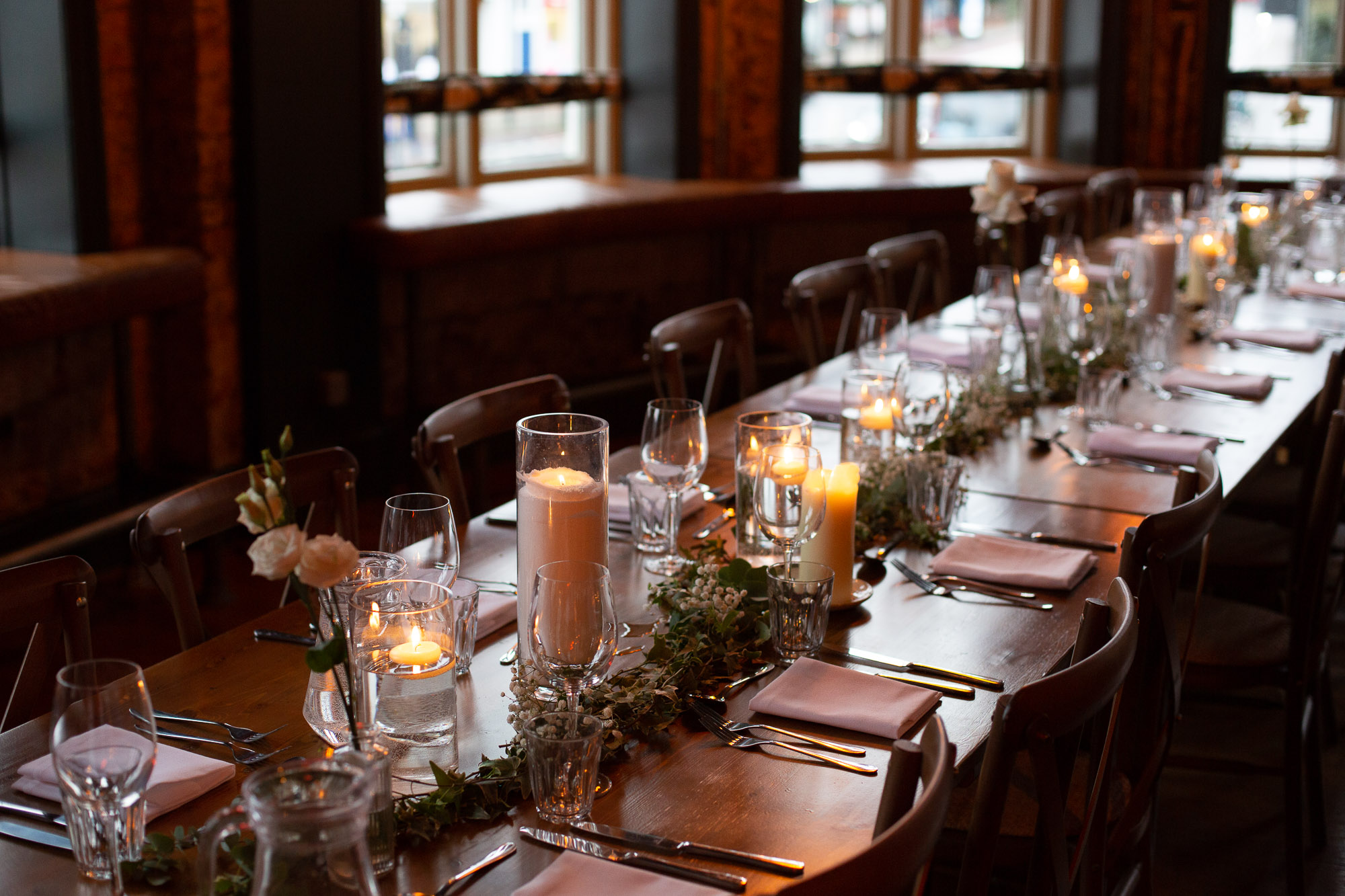 Elegant dining table with candlelight for intimate events at The Railway's First Floor Lounge. - Banner