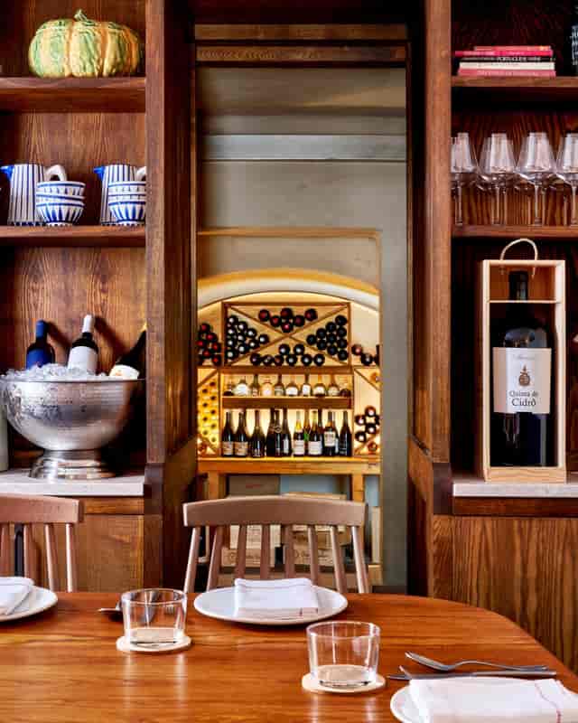 Elegant wine display in Adega Private Dining Room, perfect for sophisticated tastings and events.