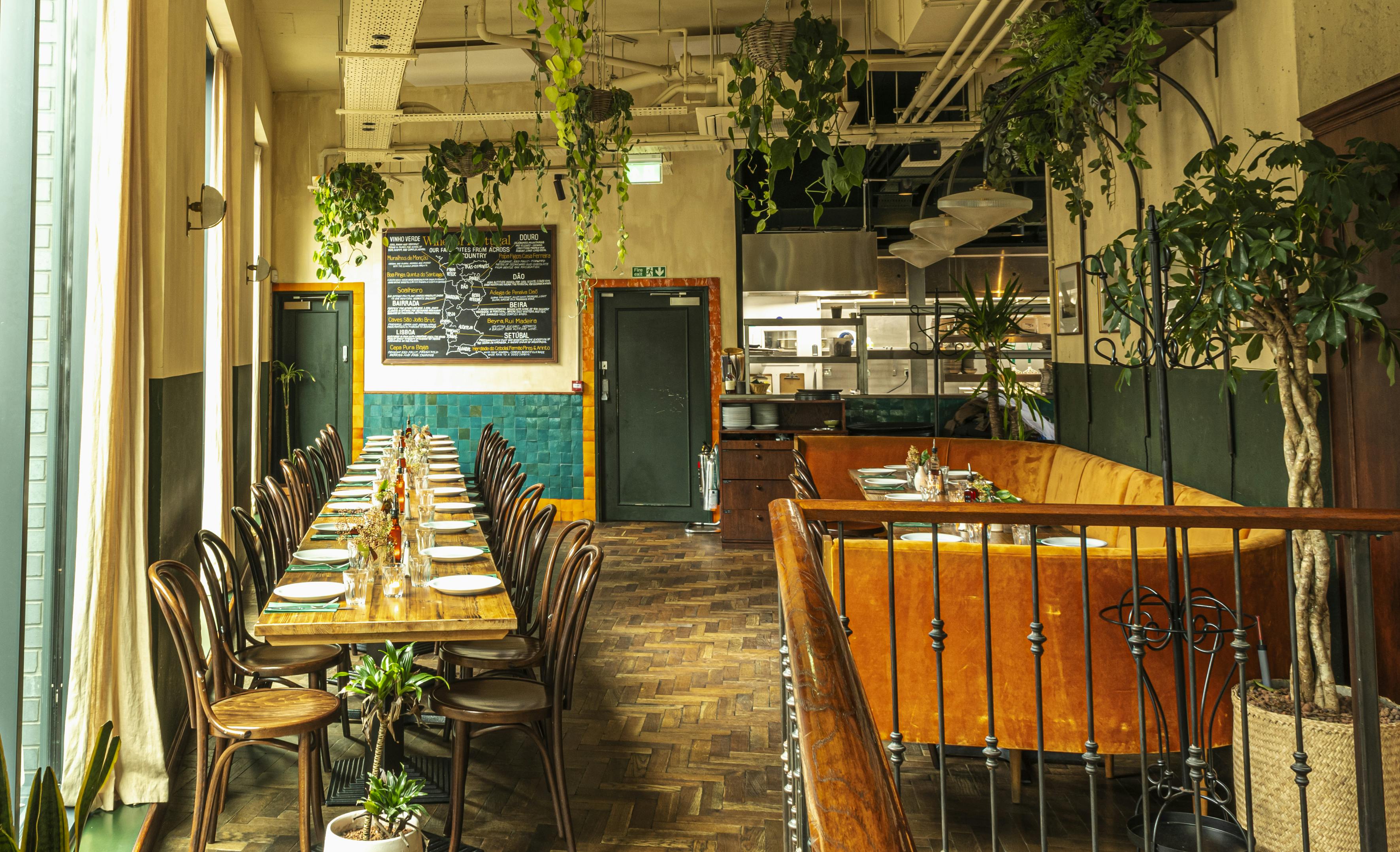 Stylish event space with wooden dining table, ideal for gatherings in Shoreditch.