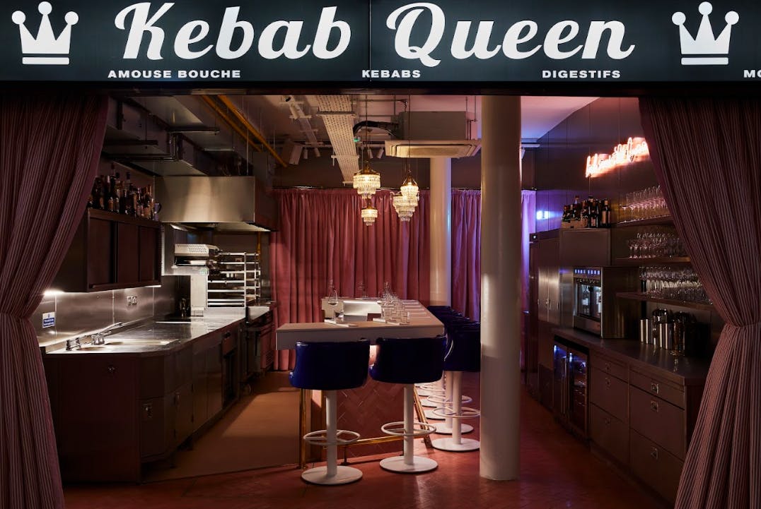 Kebab Queen dining space with vibrant signage, ideal for culinary events and gatherings.