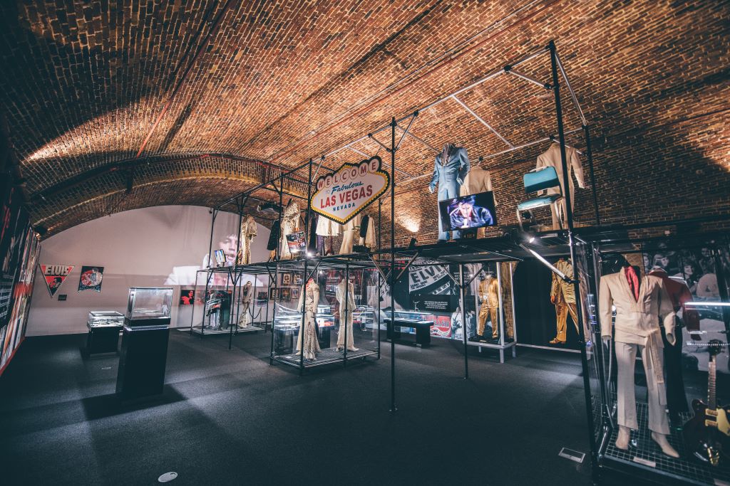 Vintage attire exhibition in unique Arches venue at London Bridge, ideal for events. - Banner