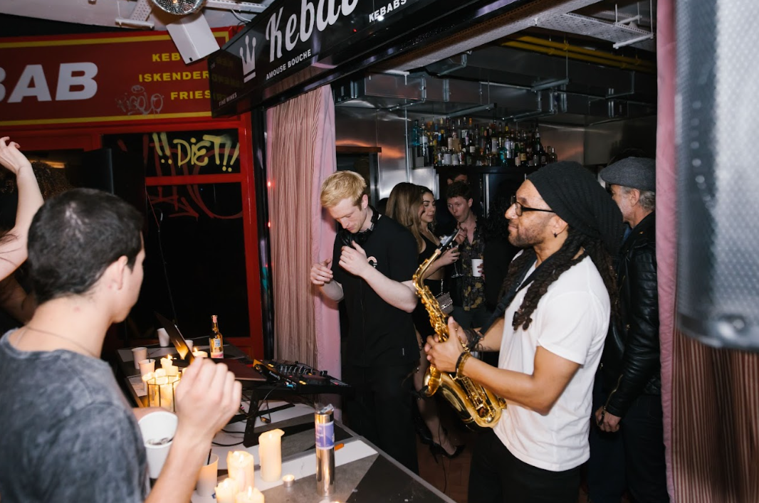 Vibrant Le Bab venue with live saxophonist for engaging networking events. - Banner
