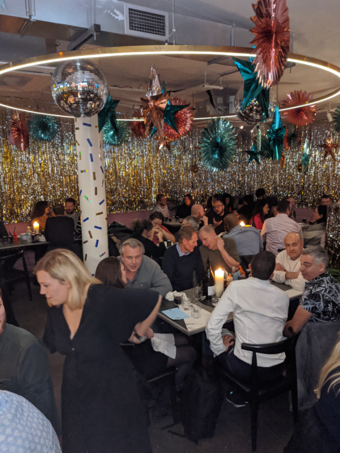 Vibrant event space at Le Bab, perfect for networking and gatherings with festive decor. - Banner