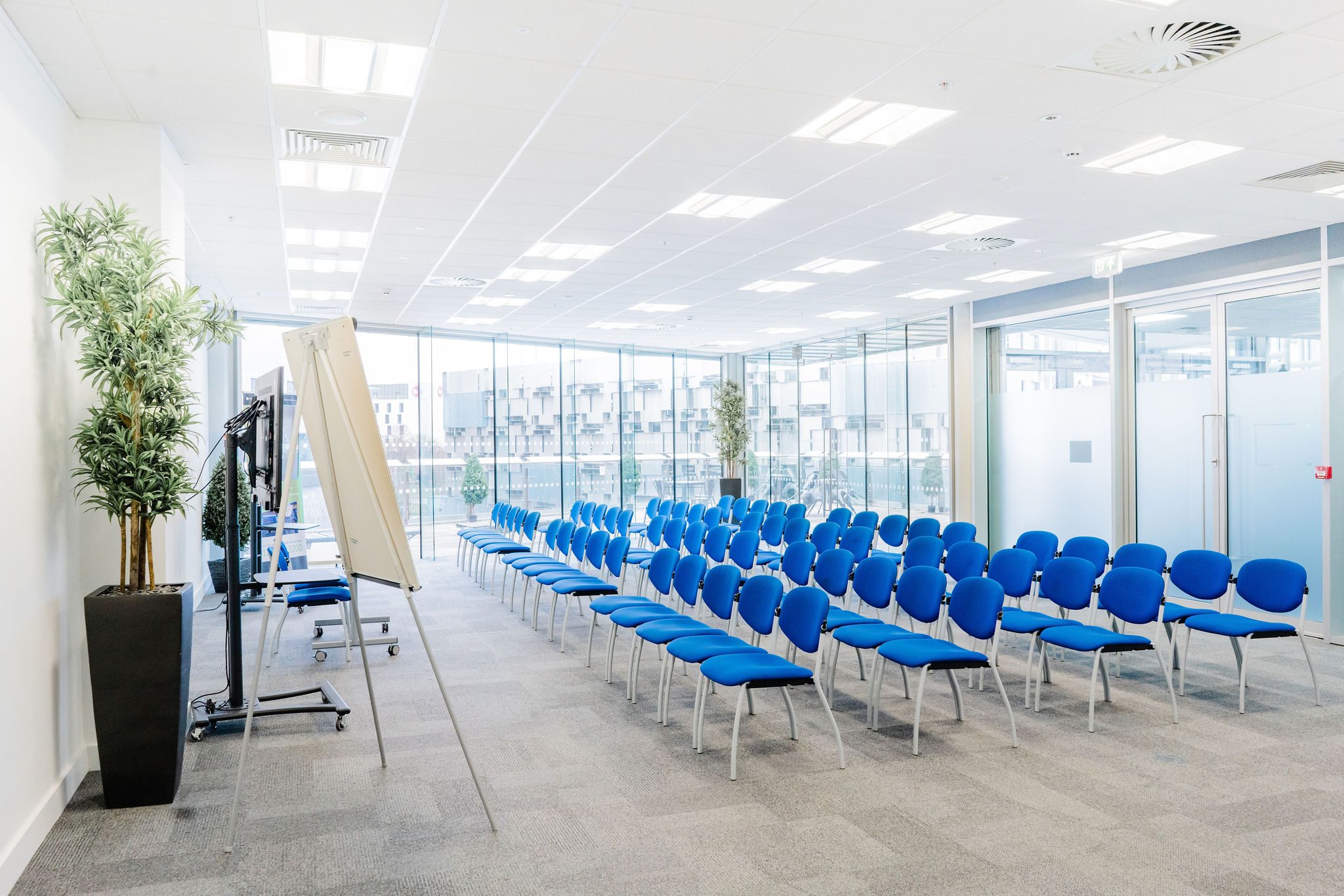 Curzon Suite at Millennium Point: bright meeting space with blue chairs for workshops. - Banner
