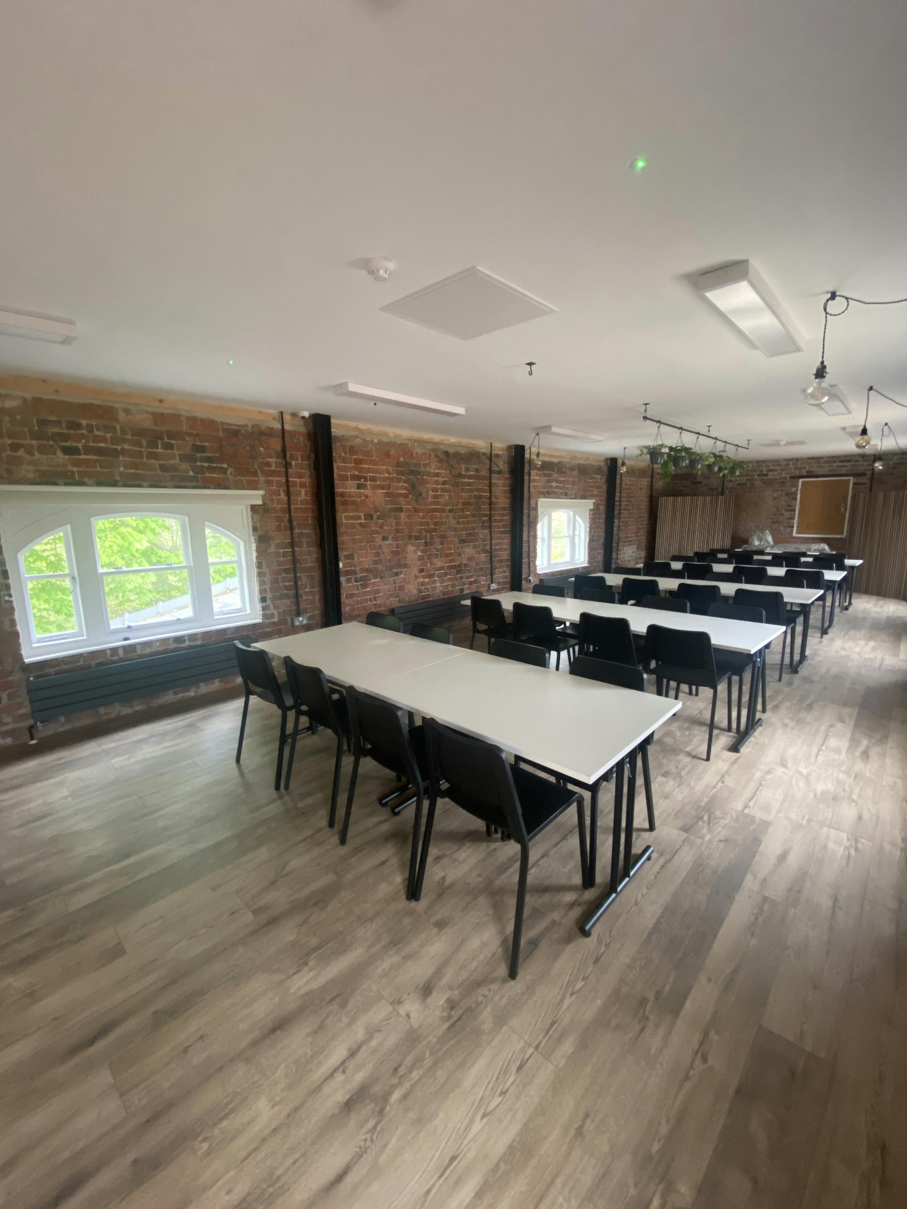 Modern meeting space at The Loft, Bowring Park; ideal for workshops and seminars.