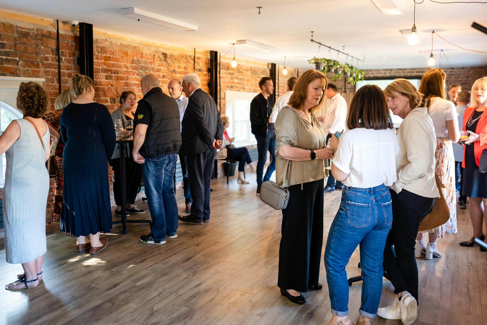 Vibrant networking event at The Loft, Bowring Park; stylish venue with warm lighting.