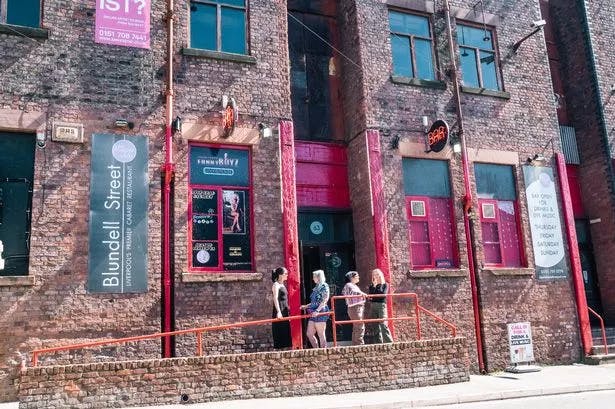 Vibrant city center venue with rustic exterior for creative events and gatherings.