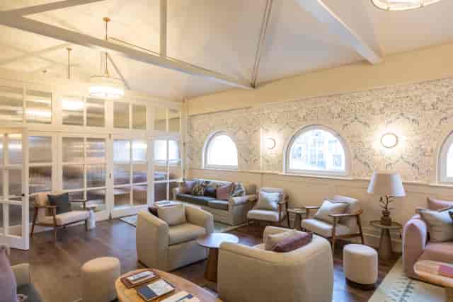 Stylish living room with arched windows, perfect for networking events and casual gatherings.