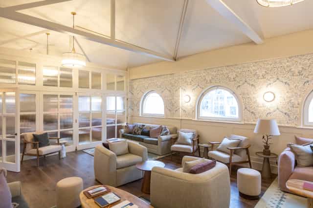 Stylish living room with arched windows, perfect for networking events and casual gatherings.