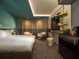 Stylish hotel room at Middle Eight, ideal for events and meetings with cozy seating.