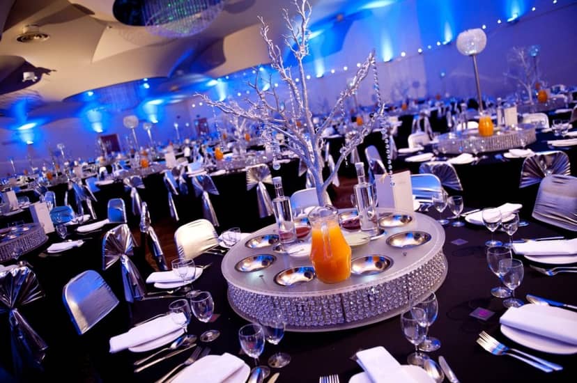Elegant event space at Pavilion Club with black linens and silver accents. Perfect for celebrations.