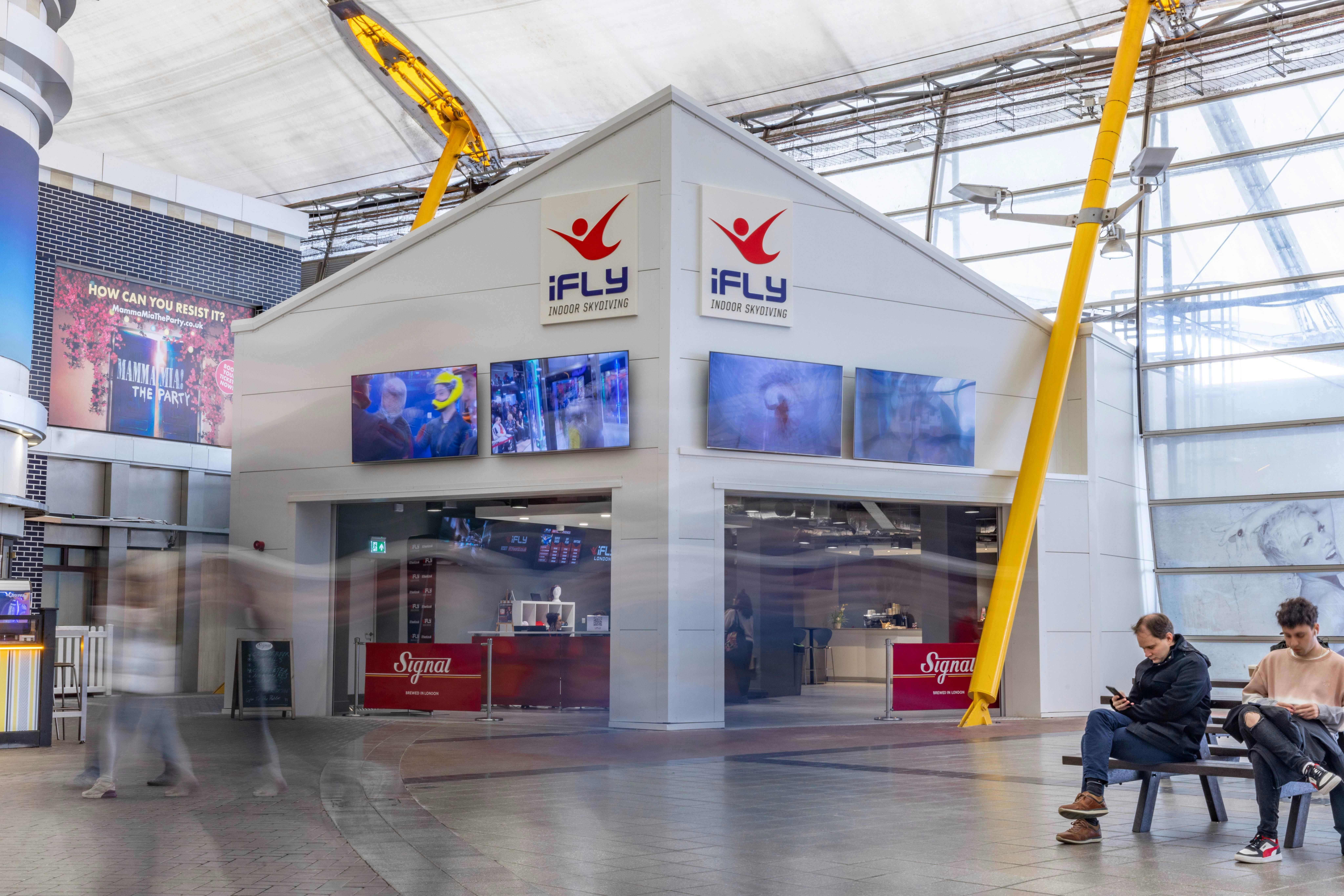 iFLY Indoor Skydiving conference room with large screens for engaging events and promotions.