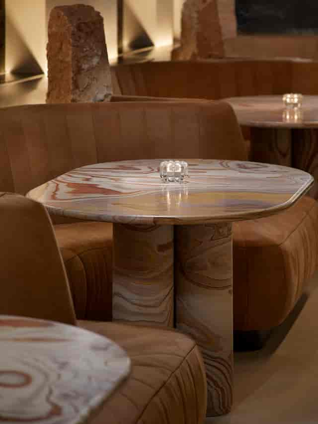 Stylish marbled table in Silverleaf lounge, perfect for networking events and meetings.