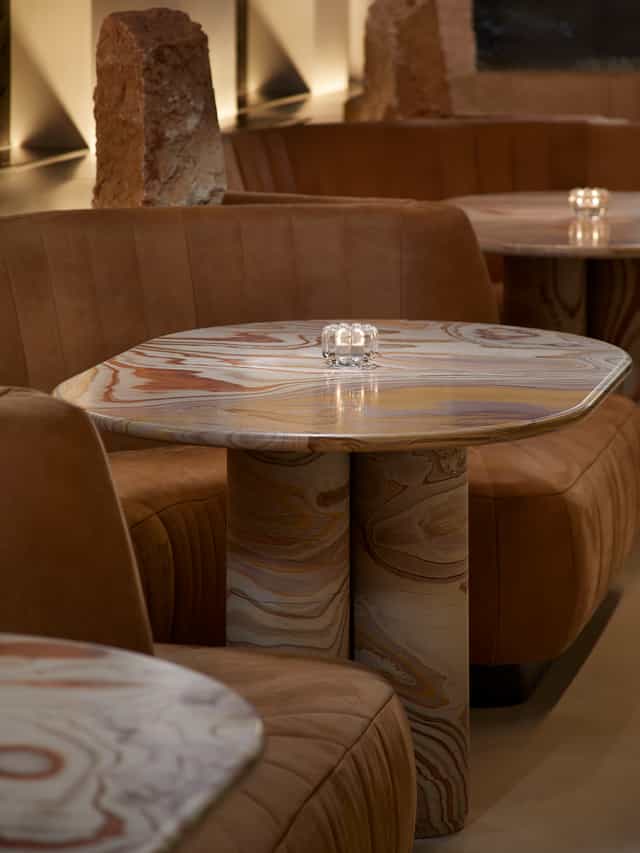 Stylish marbled table in Silverleaf lounge, perfect for networking events and meetings.