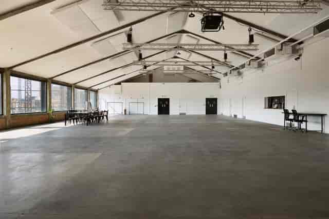 Spacious Lock Warehouse venue with high ceilings for conferences and workshops.