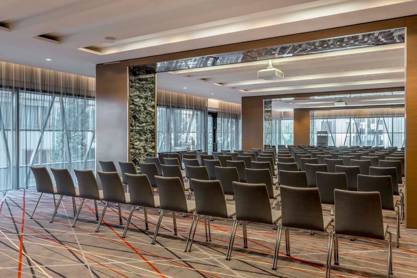 Modern event space with sleek chairs at Sheraton Zurich Hotel for corporate meetings.