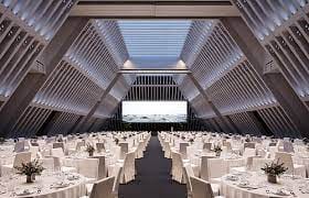 Modern Convention Hall with elegant tables, ideal for corporate events and galas.