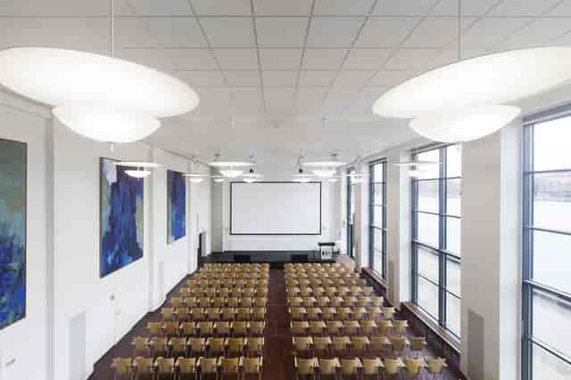 Spacious conference room with natural light for corporate events and seminars.