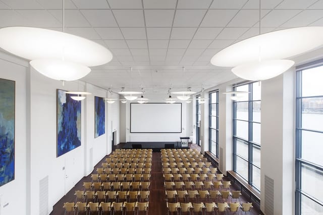 Spacious conference room with natural light for corporate events and seminars.