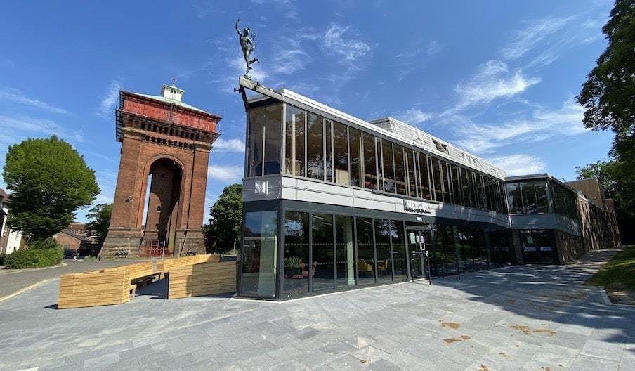 Modern Mercury Theatre Main Theatre with glass facade, perfect for corporate and social events.