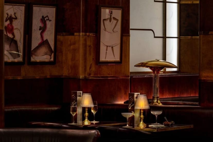 Elegant bar setting with warm lighting, perfect for networking events and meetings.