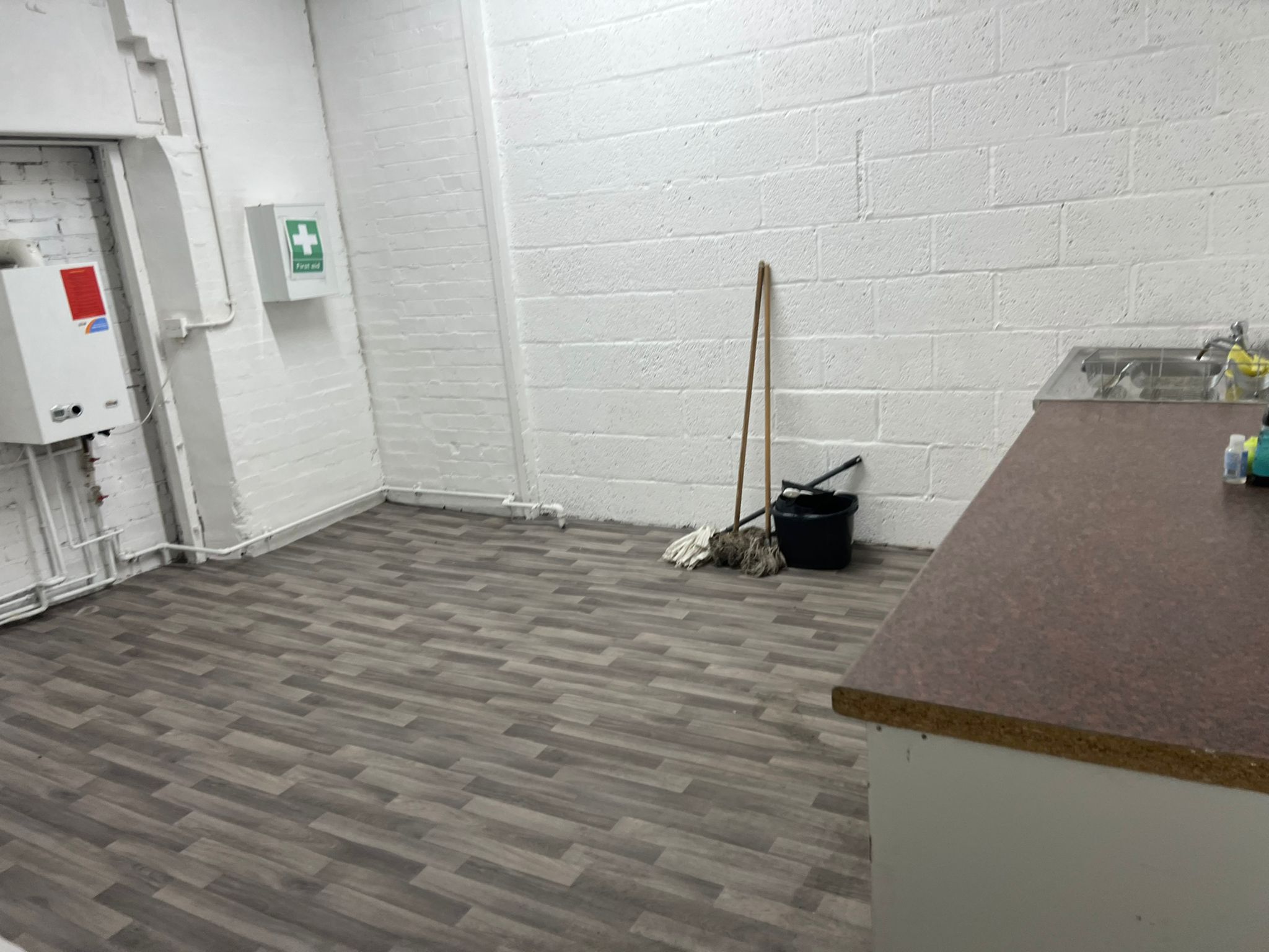 Minimalist event prep area with cleaning supplies for efficient management.