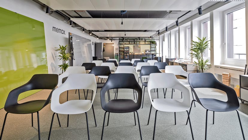 Modern meeting space with minimalist chairs, ideal for workshops and presentations.