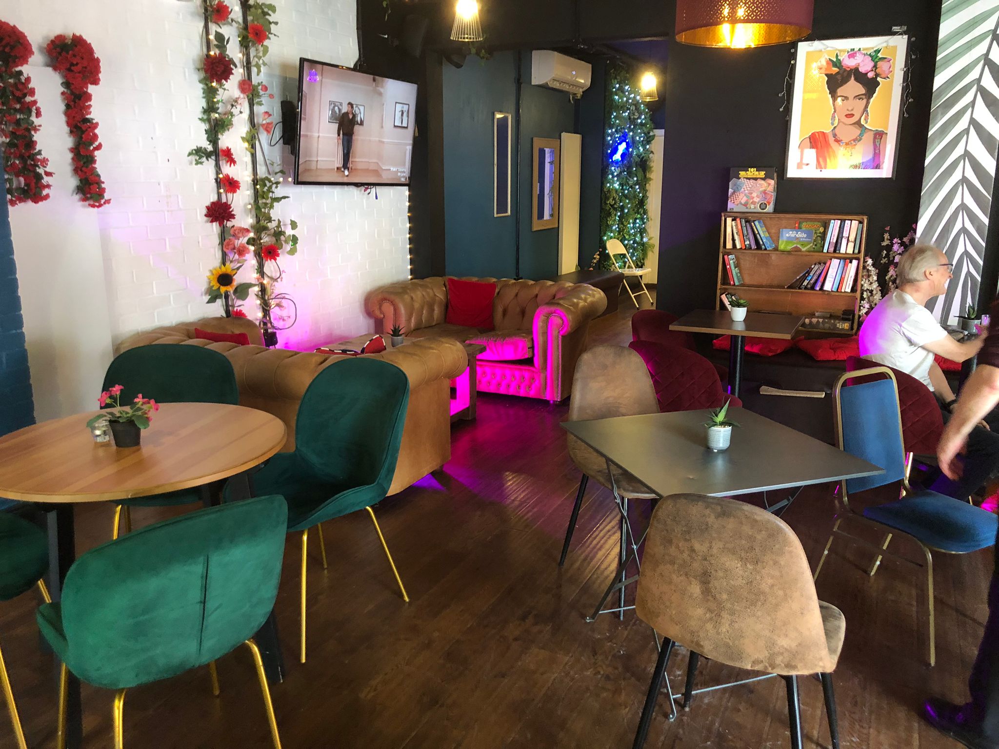 Vibrant Neptune Bar event space with cozy seating for networking and gatherings. - Banner