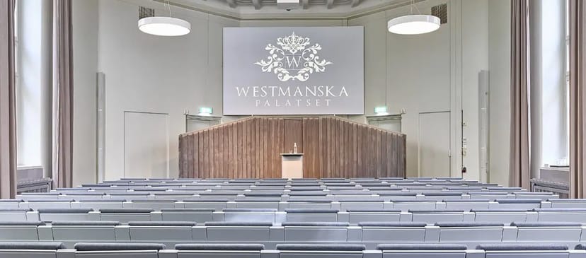 Conference space at Westmanska Palatset with tiered seating, ideal for corporate events.
