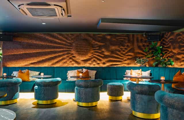 Stylish lounge event space, ambient lighting, cocktail reception