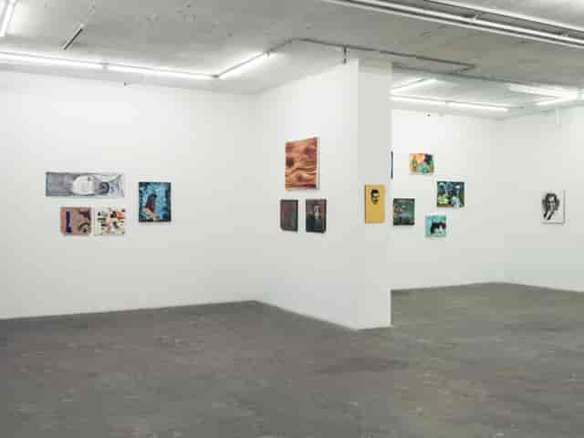 Minimalist gallery space with artworks, perfect for art exhibitions and networking events.