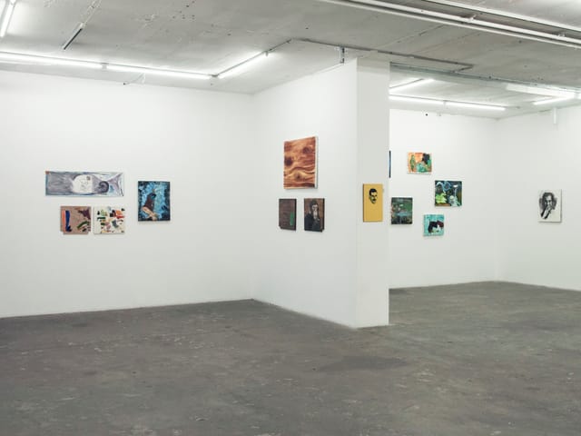 Minimalist gallery space with artworks, perfect for art exhibitions and networking events.