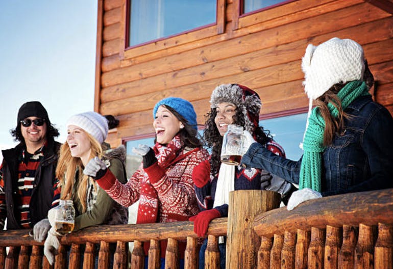 Lively winter gathering at cozy lodge, ideal for team-building and holiday parties.