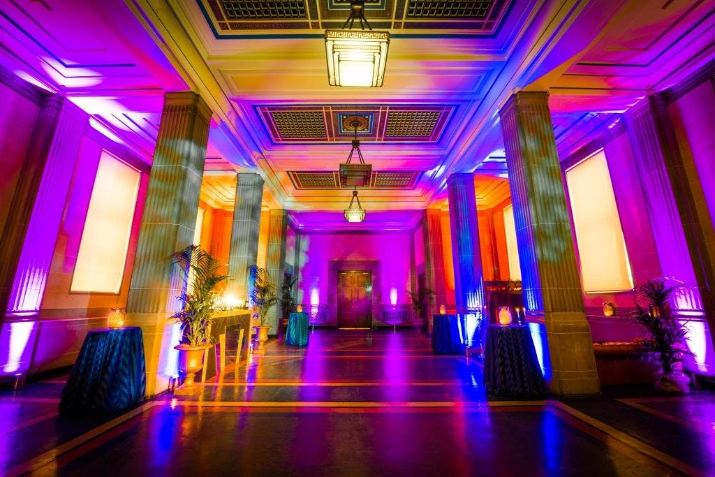 The Gallery Suite at Freemasons' Hall, elegant event space with vibrant lighting.