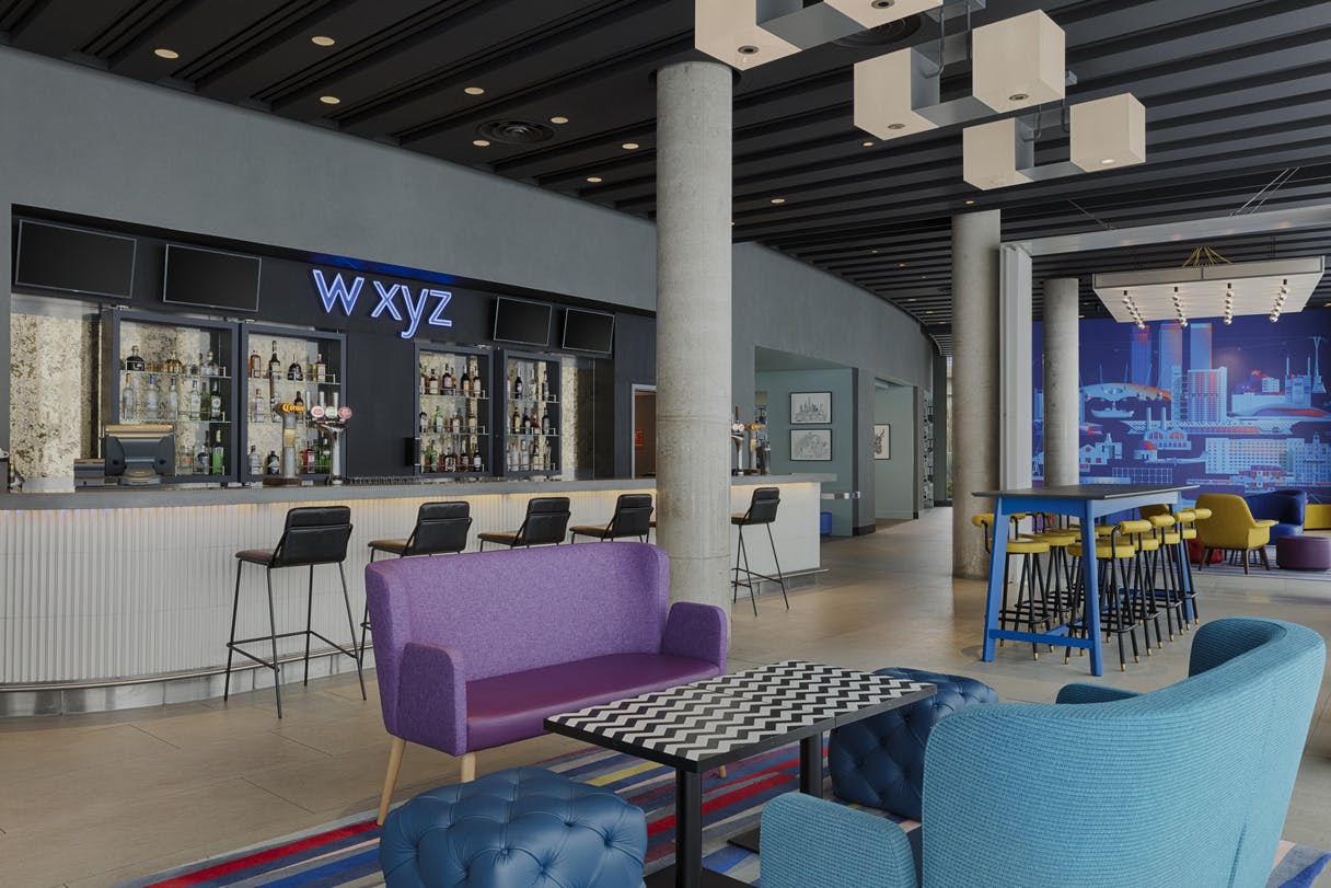 Modern WXYZ bar at Aloft London ExCeL, ideal for networking events and casual meetings.