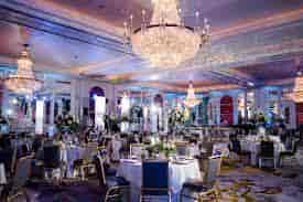 Elegant event venue with round tables, ideal for weddings and corporate events.
