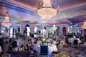 Elegant event venue with round tables, ideal for weddings and corporate events.