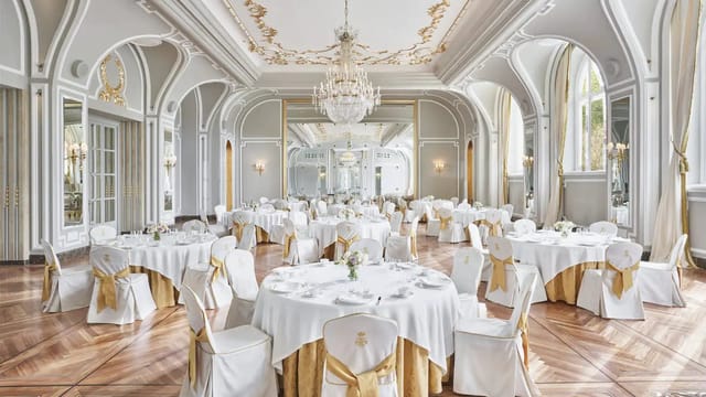 Elegant banquet hall with ornate ceilings, ideal for weddings and corporate events.