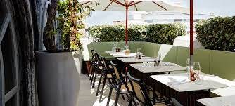 Stylish outdoor dining area at Sessions Arts Club, perfect for intimate events and networking.