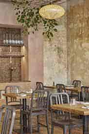 Modern dining space in Apricity, perfect for events and gatherings with rustic charm.