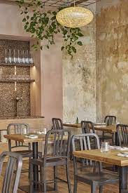 Modern dining space in Apricity, perfect for events and gatherings with rustic charm.