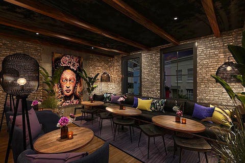 Private dining space in Los Mochis with exposed brick, ideal for networking events. - Banner